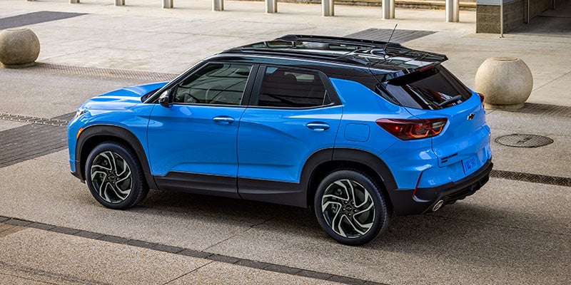 Blue Chevrolet Trailblazer parked near building