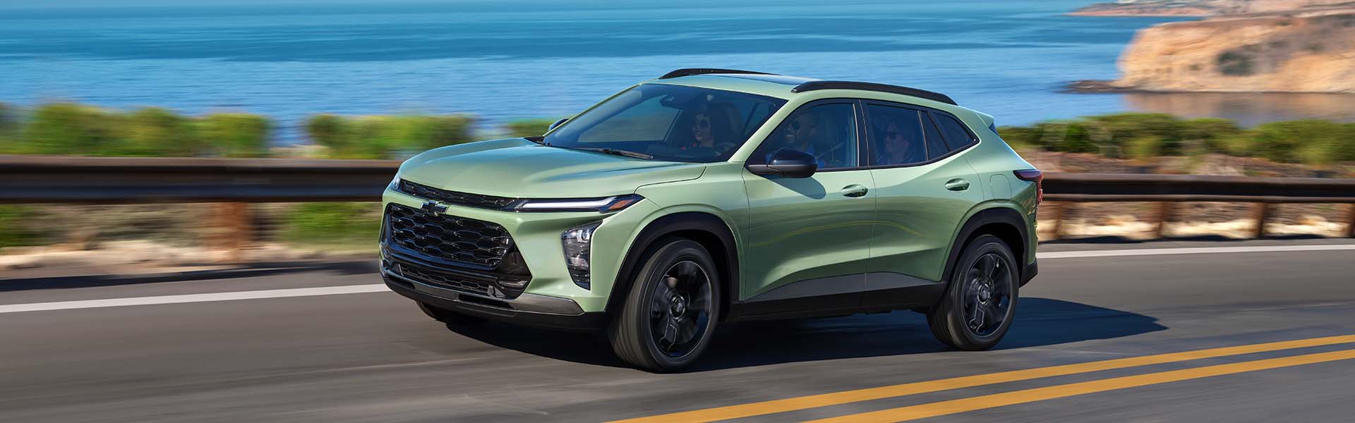 green Chevrolet Trax running on road